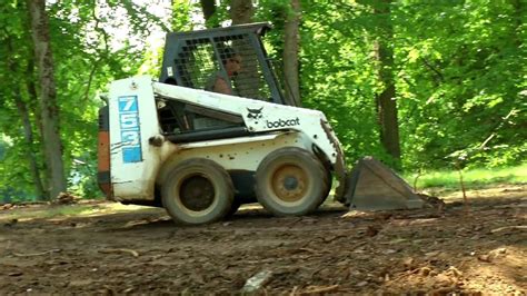 how to level dirt with a skid steer|how to level a skid steer.